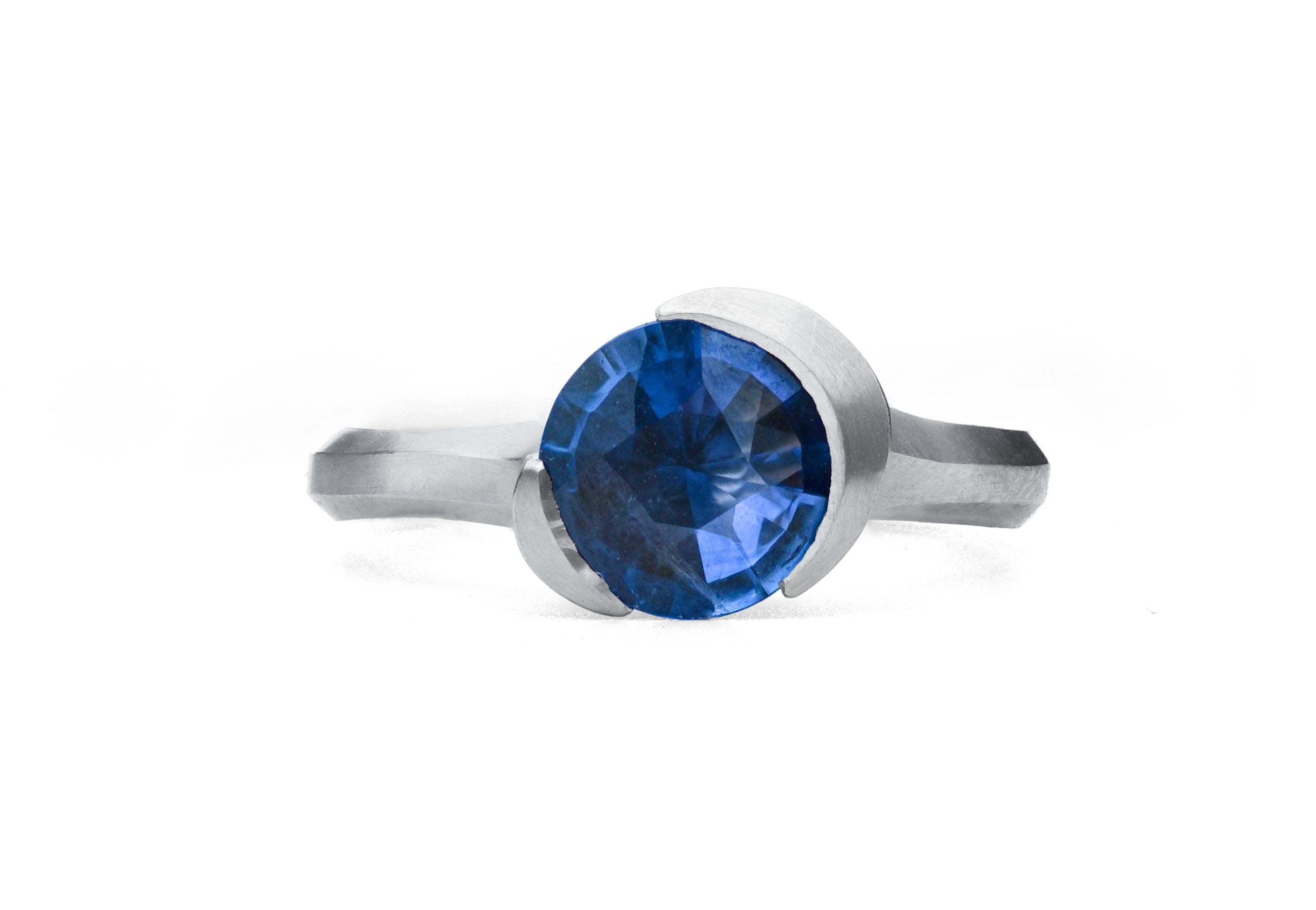 Arris carved platinum and sapphire ring