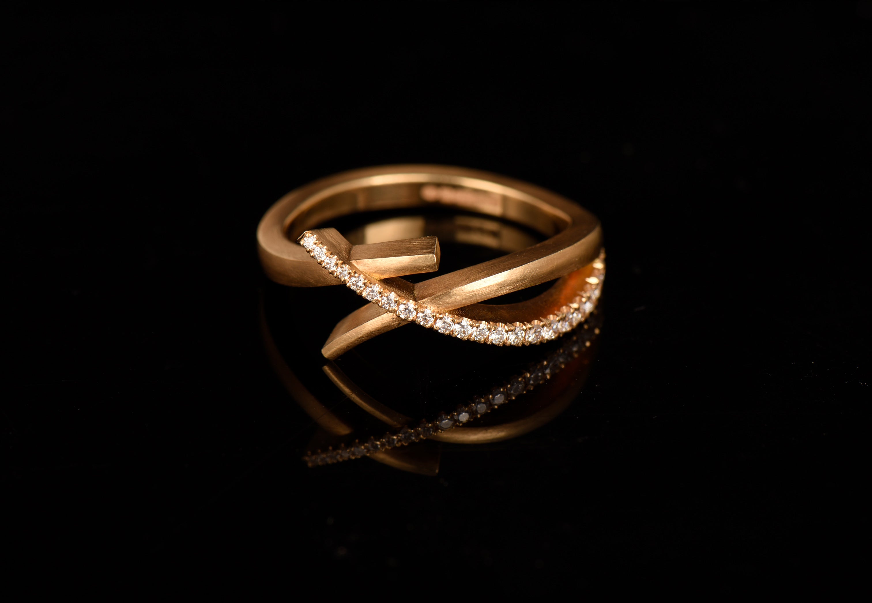 Rose gold and diamond crossover ring