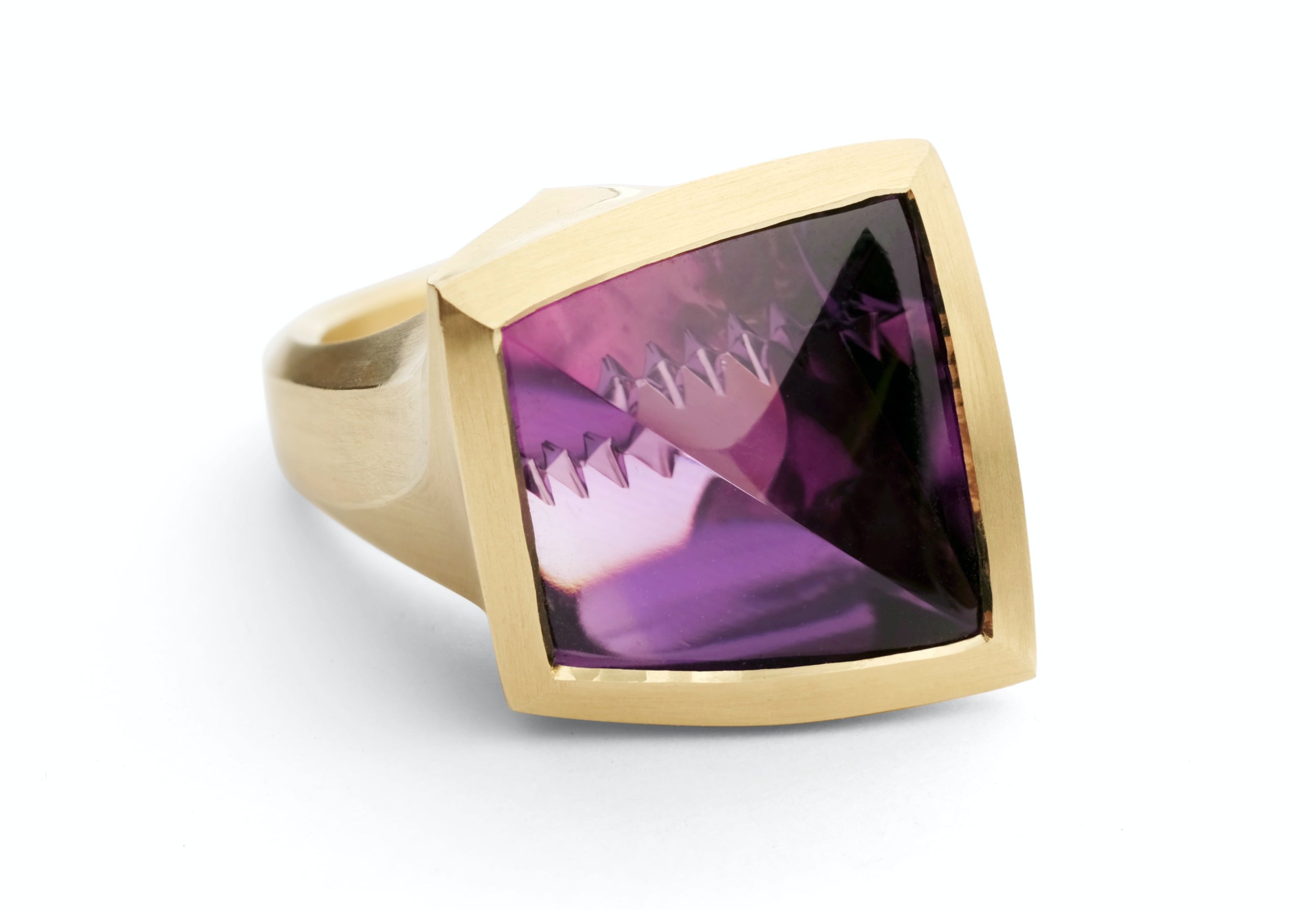 Arris: Fancy cut 16 carat amethyst set in yellow gold.-McCaul