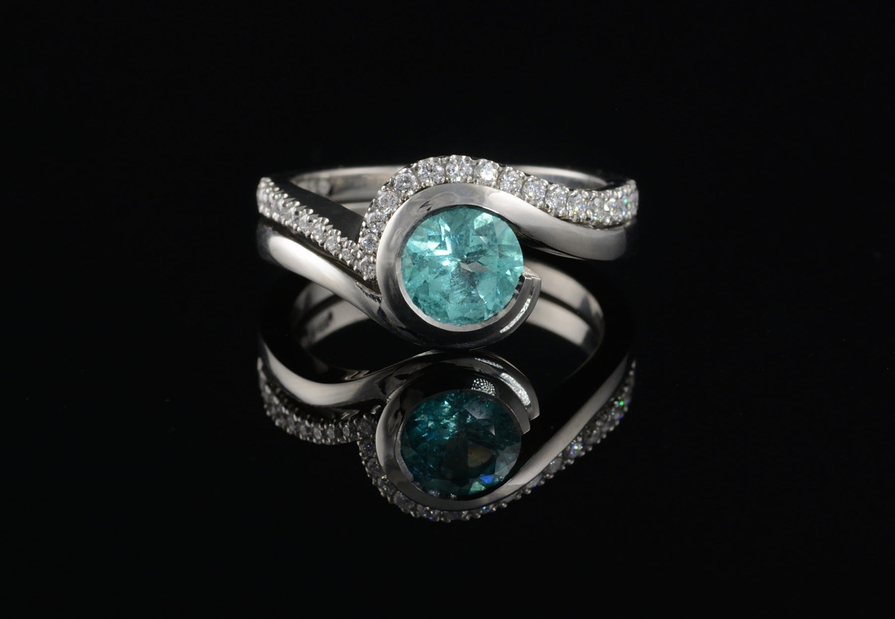 Wave Paraiba tourmaline platinum engagement ring and white diamond pave set fitted wedding ring