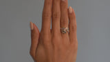 'Twist' rose gold engagement ring with pear shaped cognac diamond