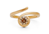 Contemporary 'Twist' 18 carat rose gold and round cognac diamond engagement ring