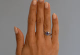 Platinum and violet sapphire wave engagement ring